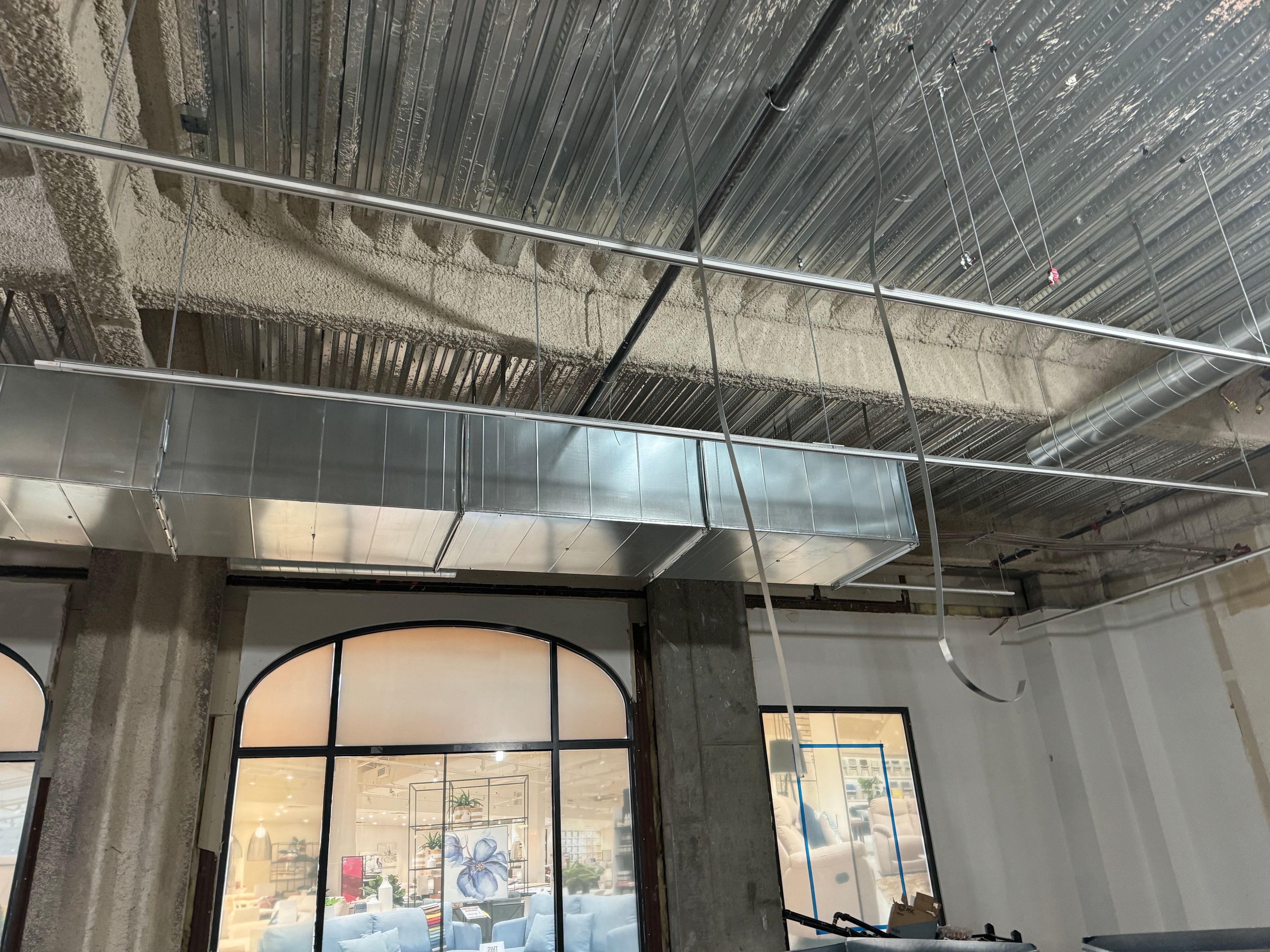 Rectangular supply trunk along storefront
