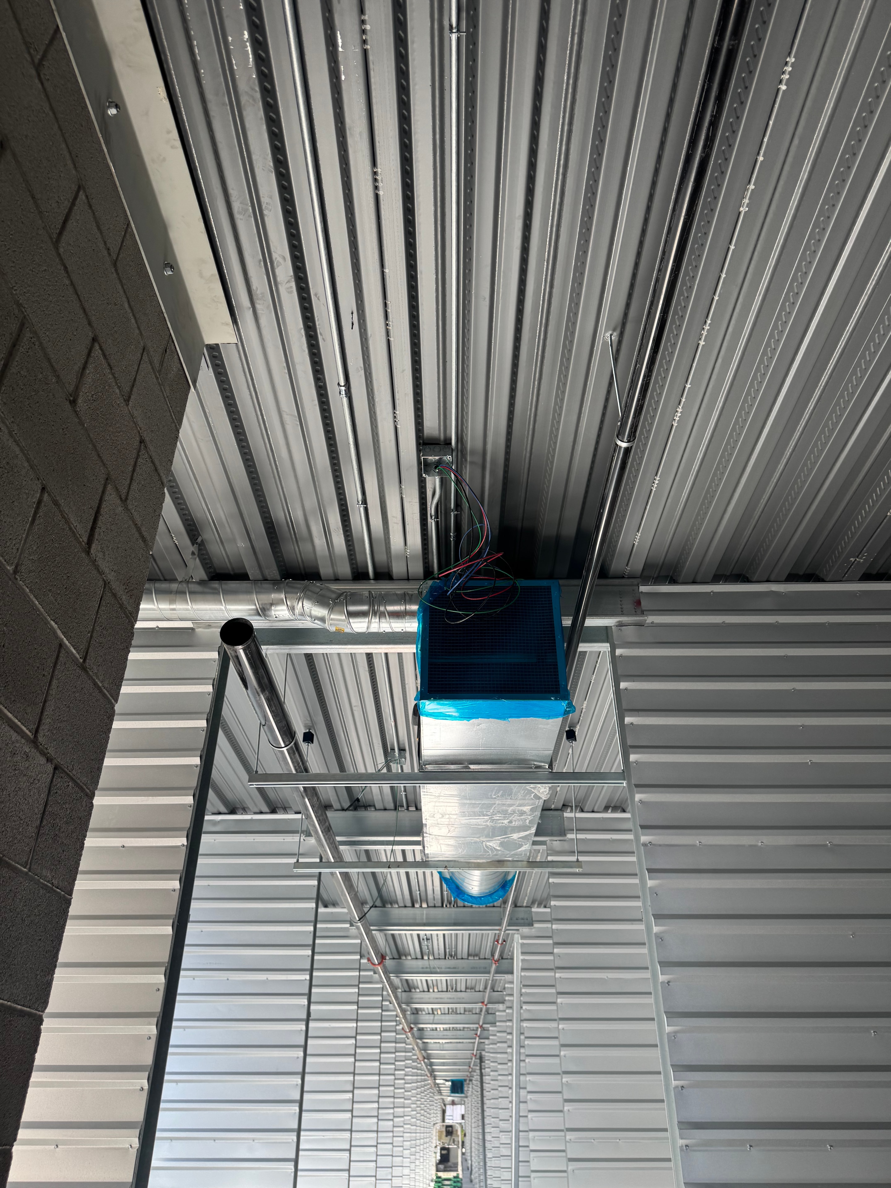 Fan coil cassette array — long corridor view
